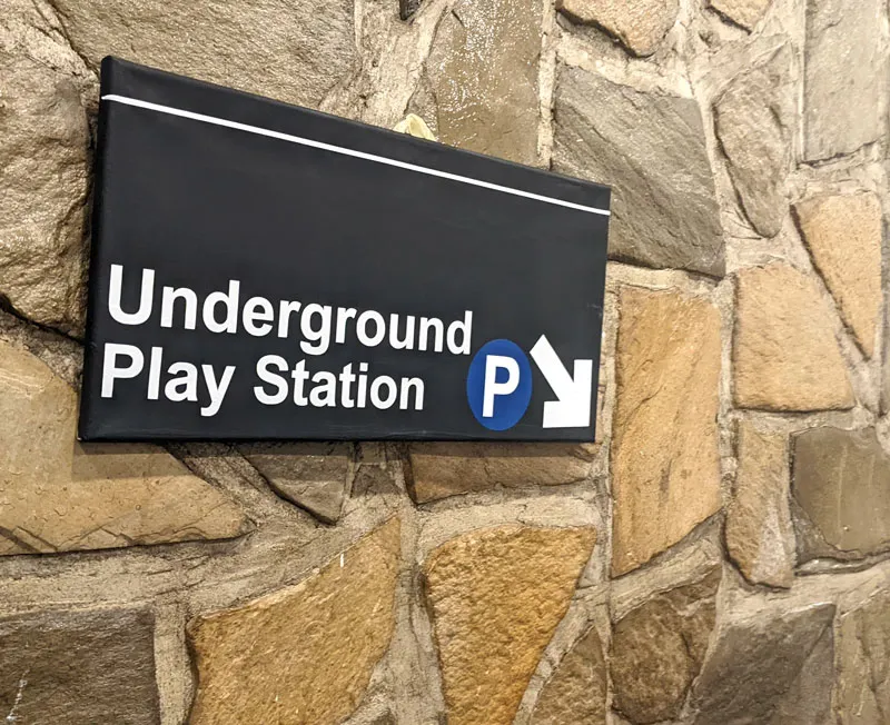 A DIY Cricut subway-inspired playroom wall sound that says "Underground Play Station".