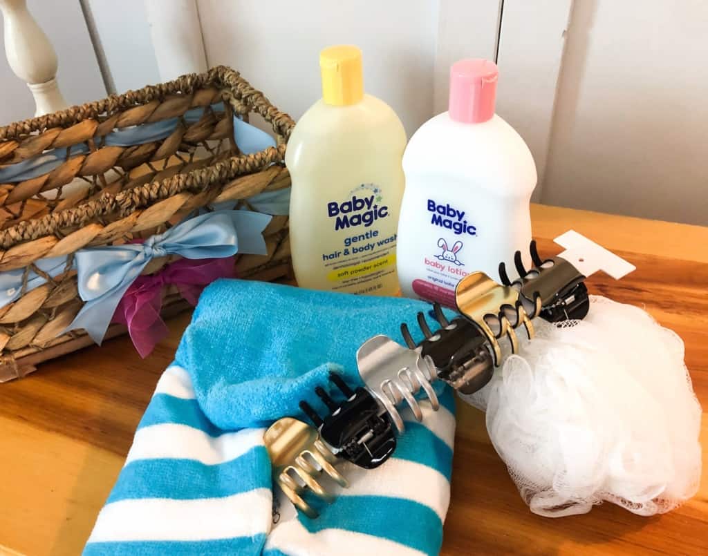 gender reveal gift basket ideas including baby wash, lotion, hooded towel
