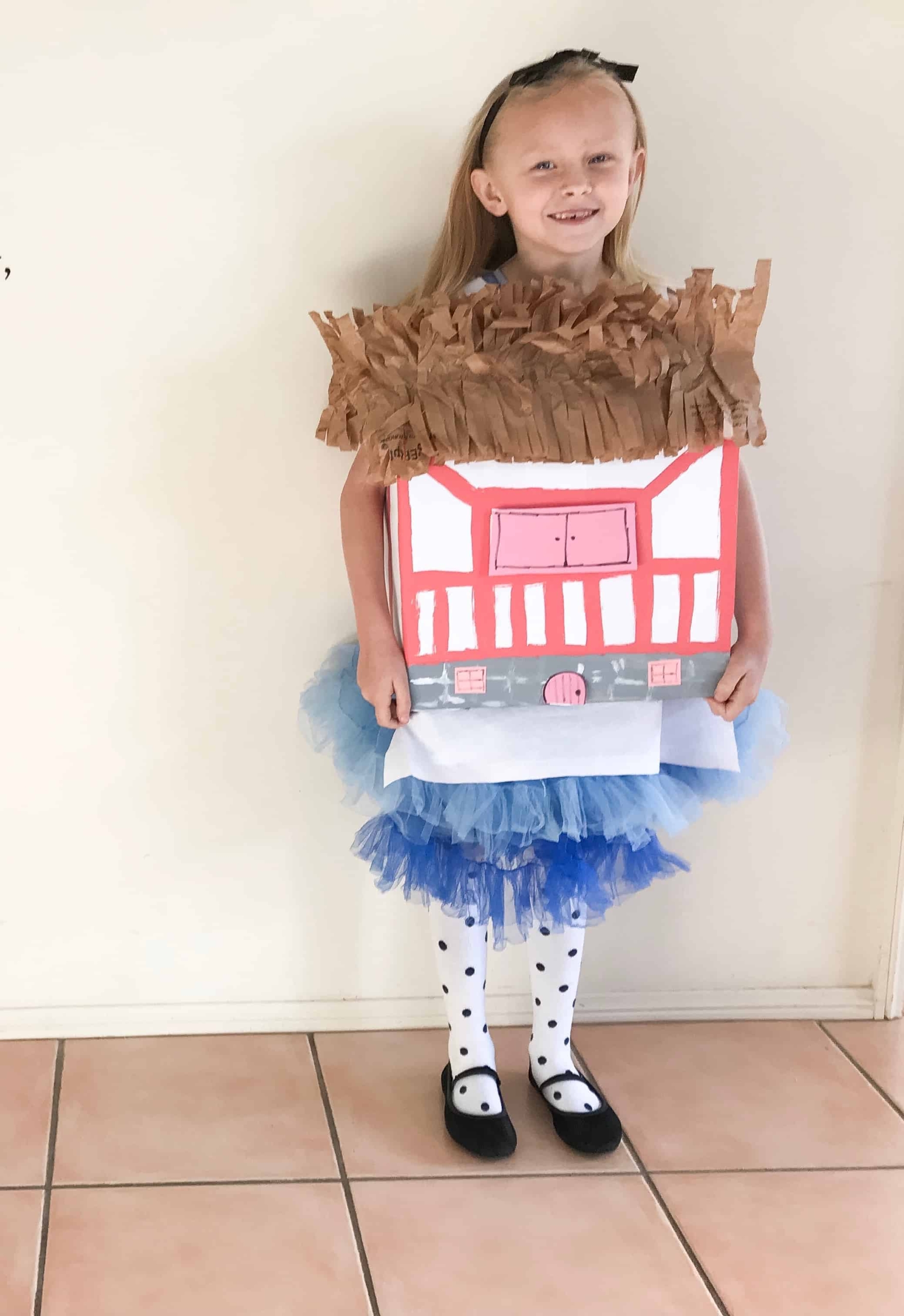 A girl in a DIY Alice in Wonderland house costume with tulle.