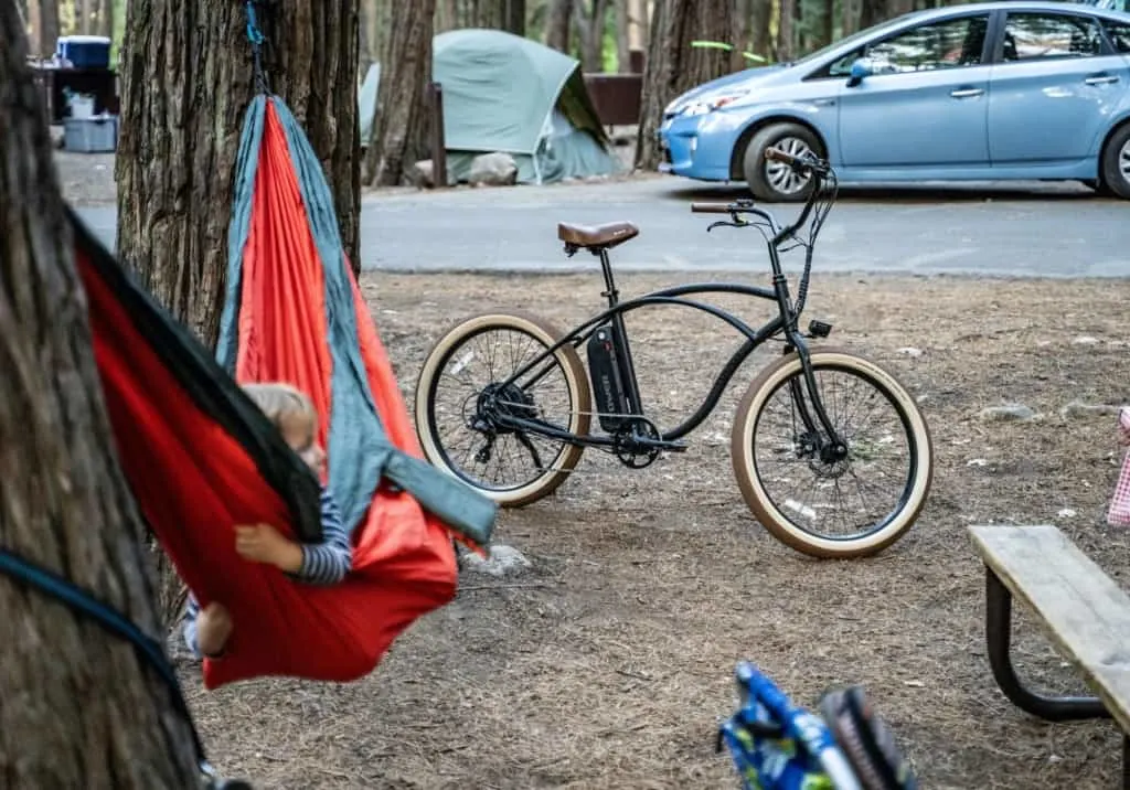 child in hammock at campsite