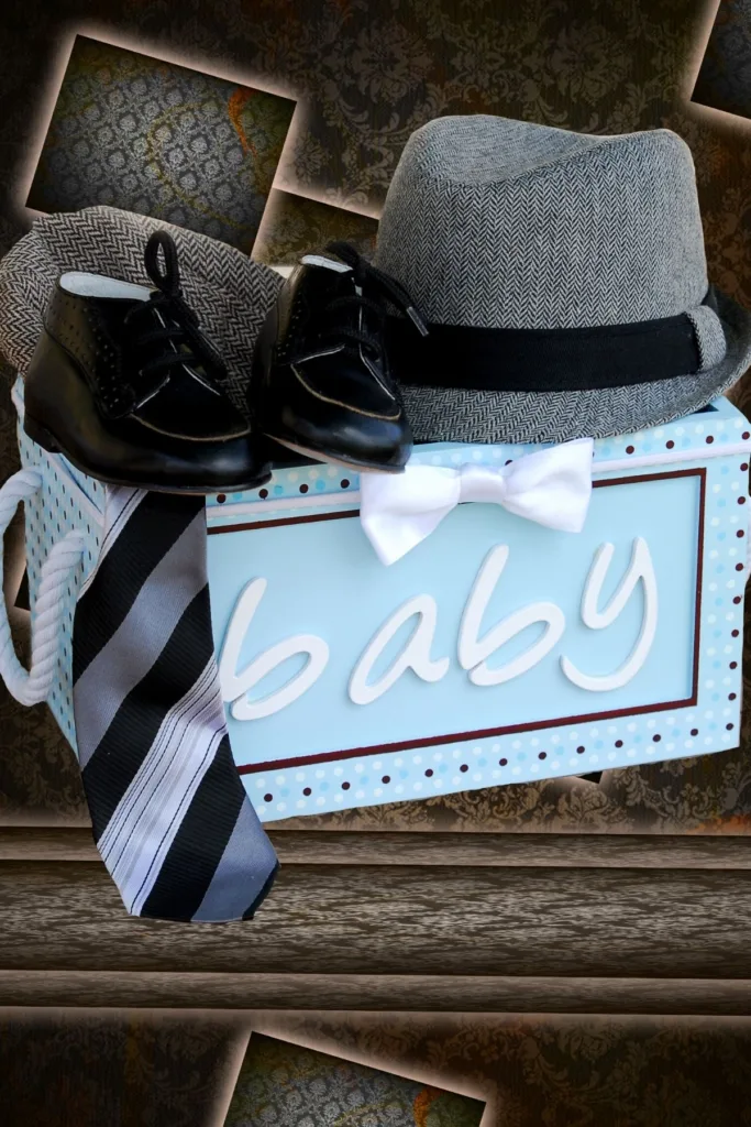 A Blue sign that says baby and a baby suit and tie.