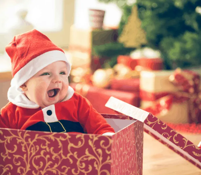 Baby in Christmas gift box.