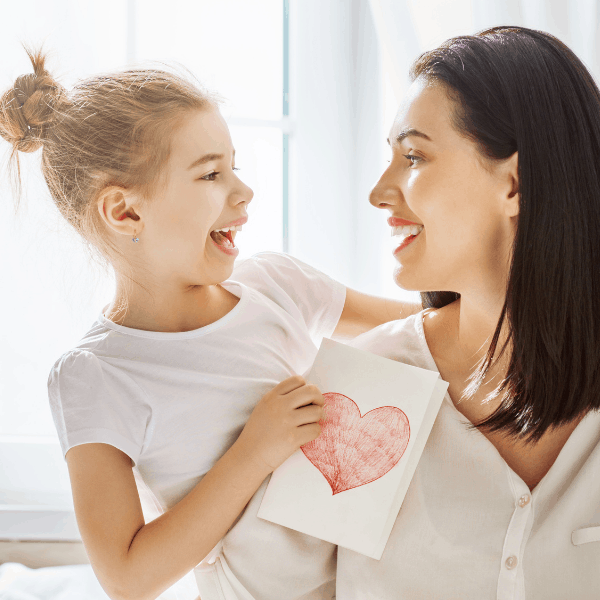 Daughter gives gifts for mom.