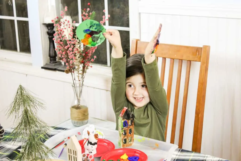 little girl making simple christmas crafts