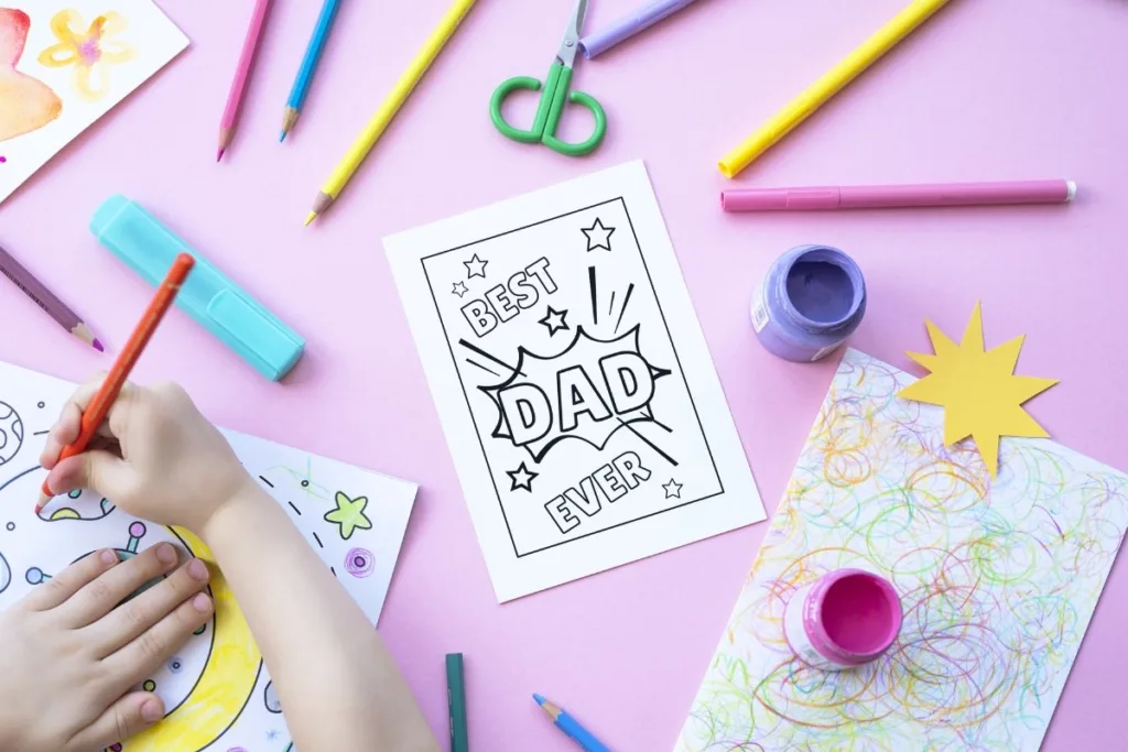 A child coloring a free printable Father's Day card.