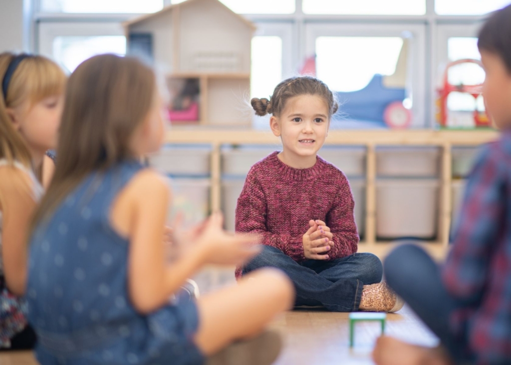 Children play games in a circle.