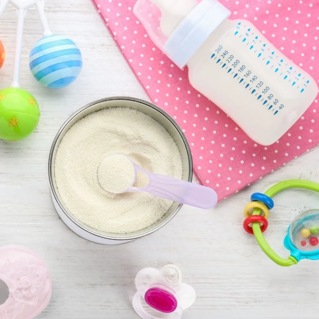 Baby formula container with scoop.