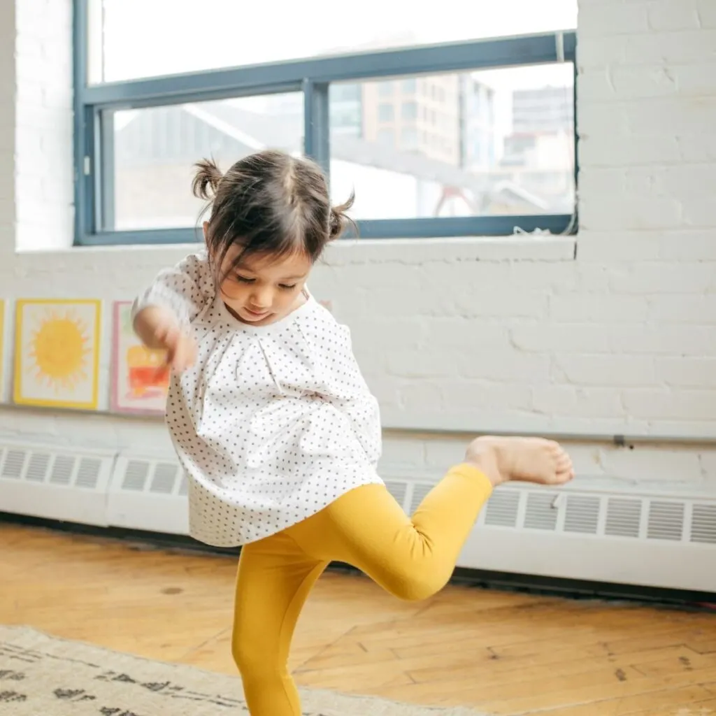 Girl dancing to spanish kids songs.