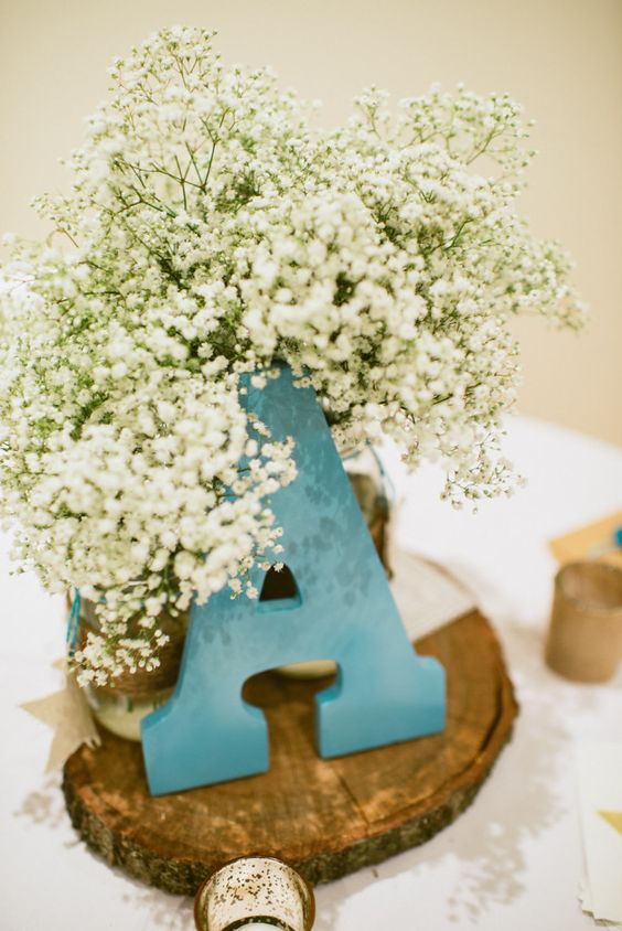 Large wooden letter and baby's breath flowers decor