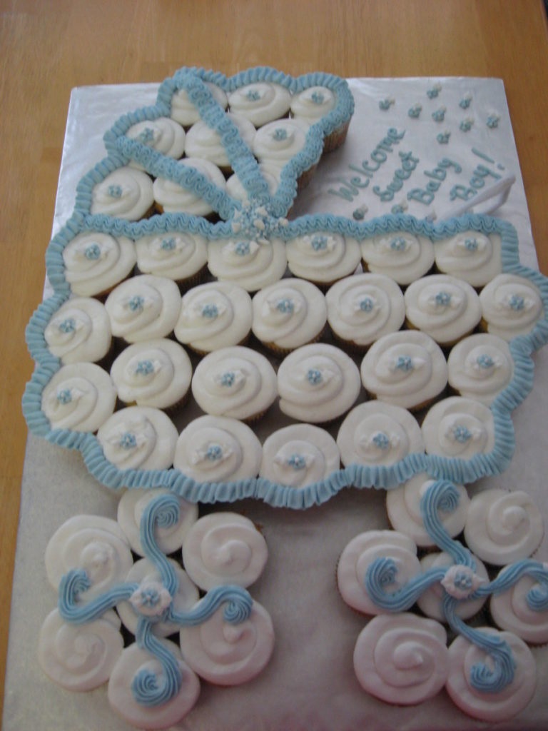 Cupcakes arranged into a baby carriage shape