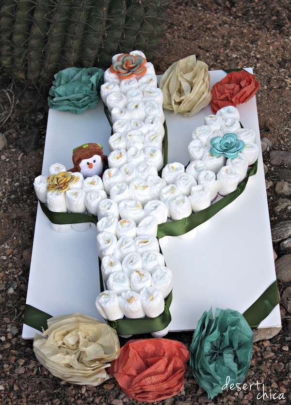 Cactus baby shower diaper cake with flowers.