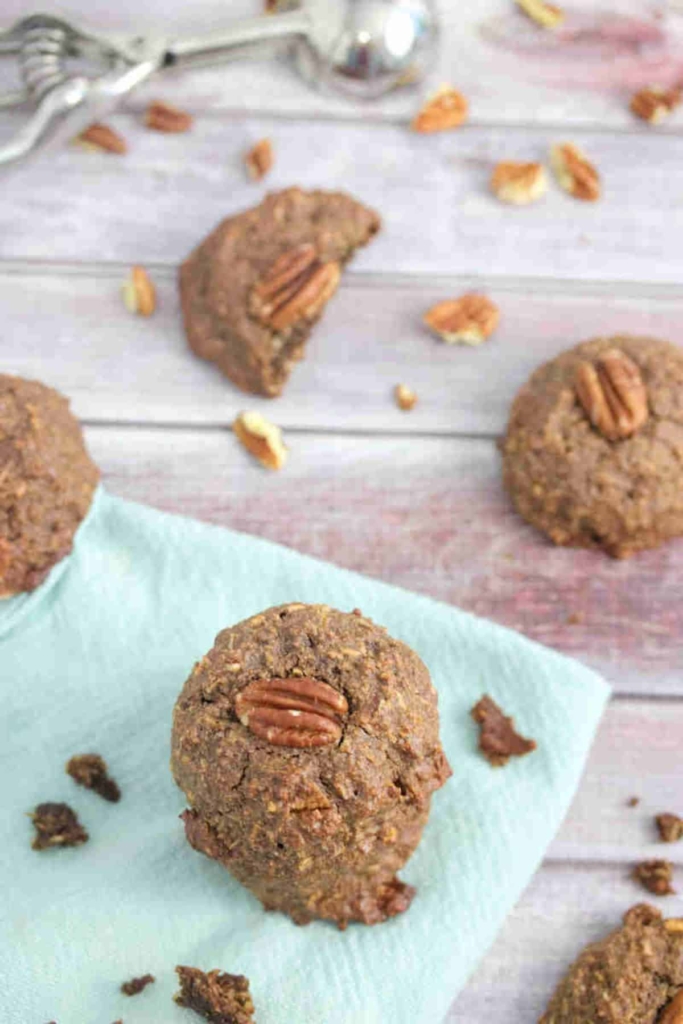 Lactation cookies with pecans on a kitchen towel.
