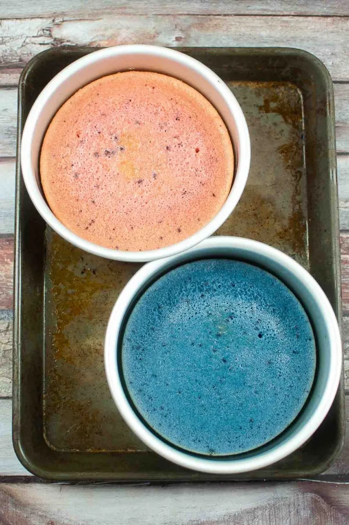 Pink and blue cakes in cake pans