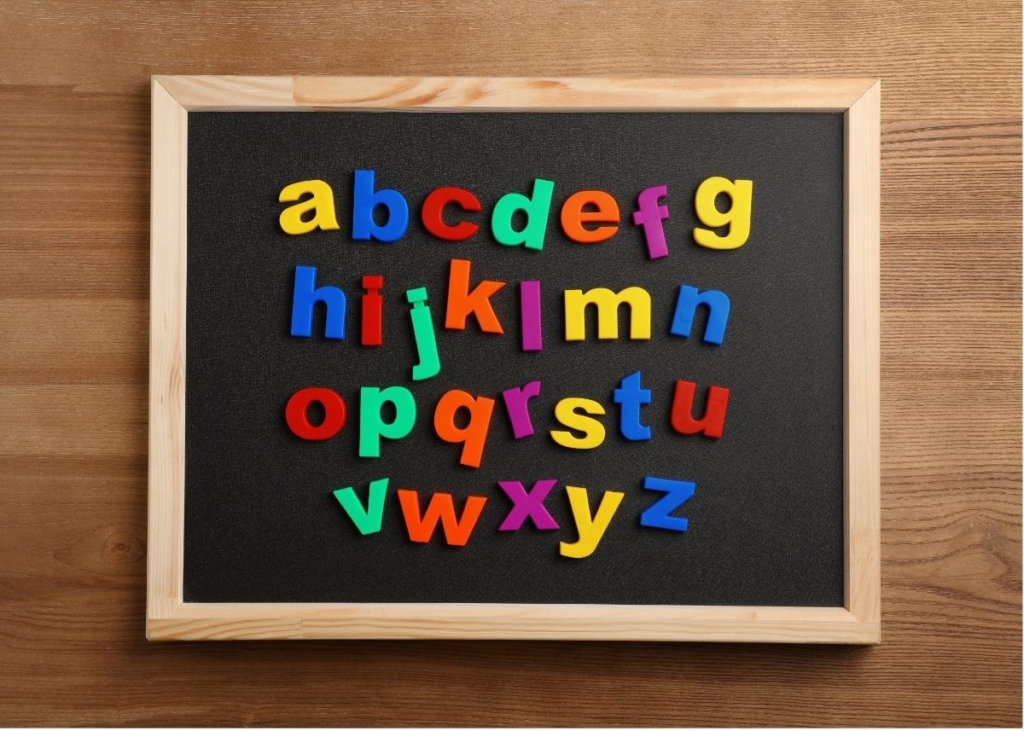 Alphabet magnets on a mini chalkboard.