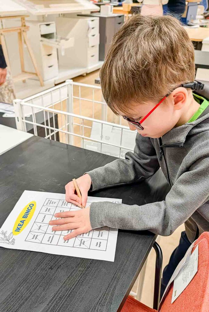 ikea-bingo-family-activity-3 Boy working on IKEA bingo